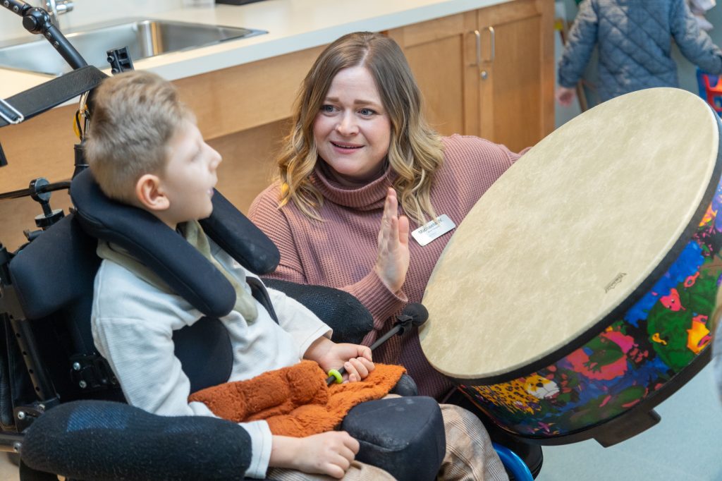 The Braun family enjoy a Music Therapy sessions with Canuck Place Music Therapist Michaela Wallis.