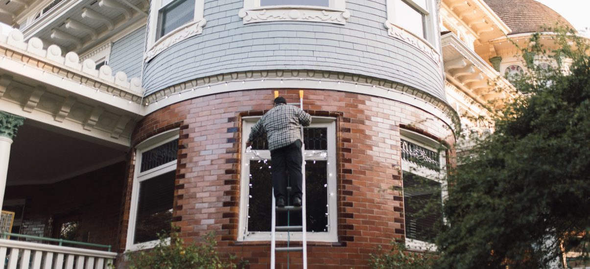 Ken Pukanich, Facilities Manager at Canuck Place setting up the holiday lights