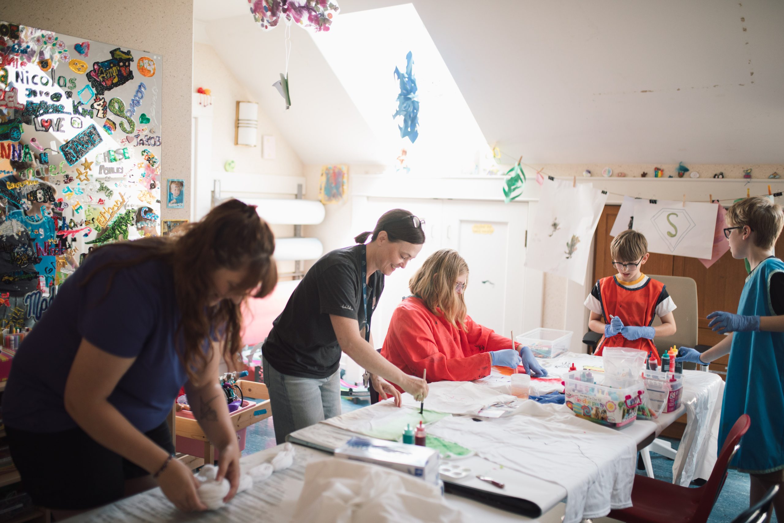 Rempel family doing tye-dye arts and crafts at Glen Brae Manor