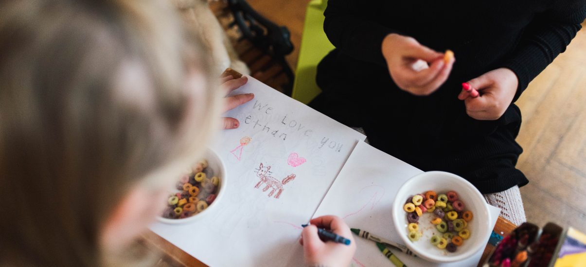 The Van Oosterom siblings sit and draw a picture together for their broth Ethan, who passed away when he was a baby.