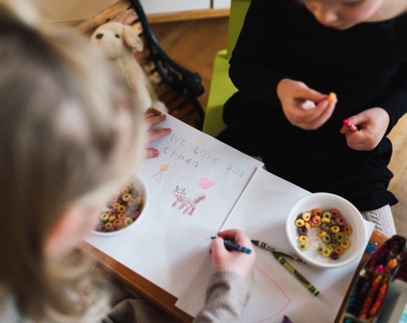 The Van Oosterom siblings sit and draw a picture together for their broth Ethan, who passed away when he was a baby.