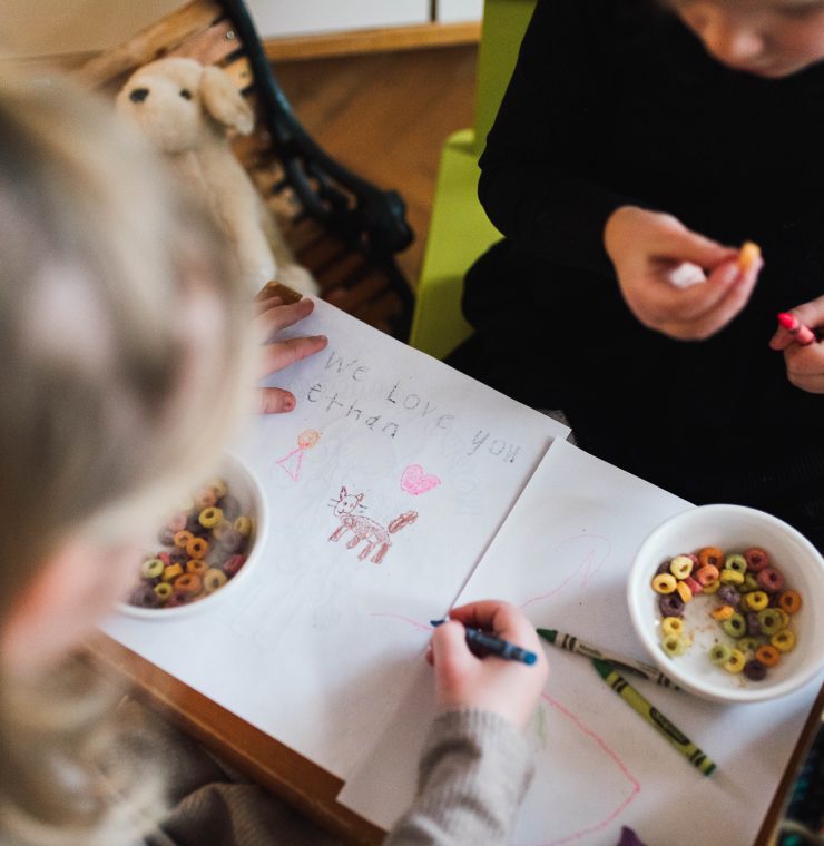 The Van Oosterom siblings sit and draw a picture together for their broth Ethan, who passed away when he was a baby.