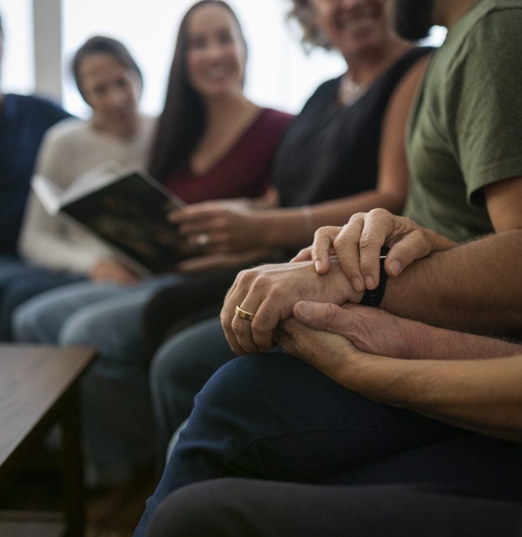 The Angel family shares a tender moment with Canuck Place Counsellor Mary Coleman.