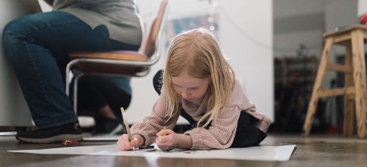 Girl draws on floor