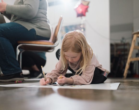 Girl draws on floor