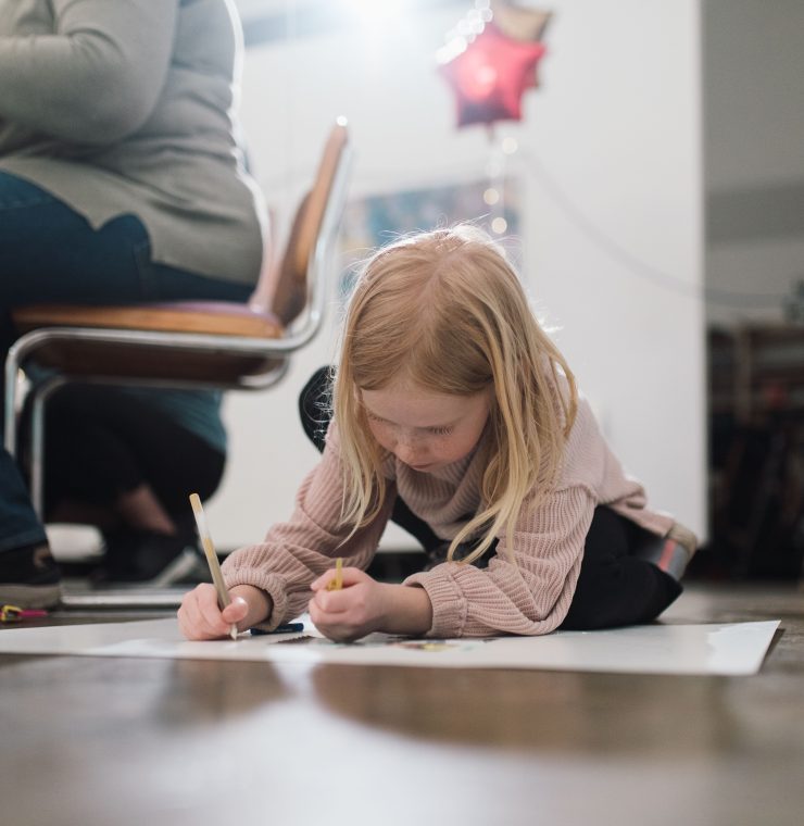 Girl draws on floor